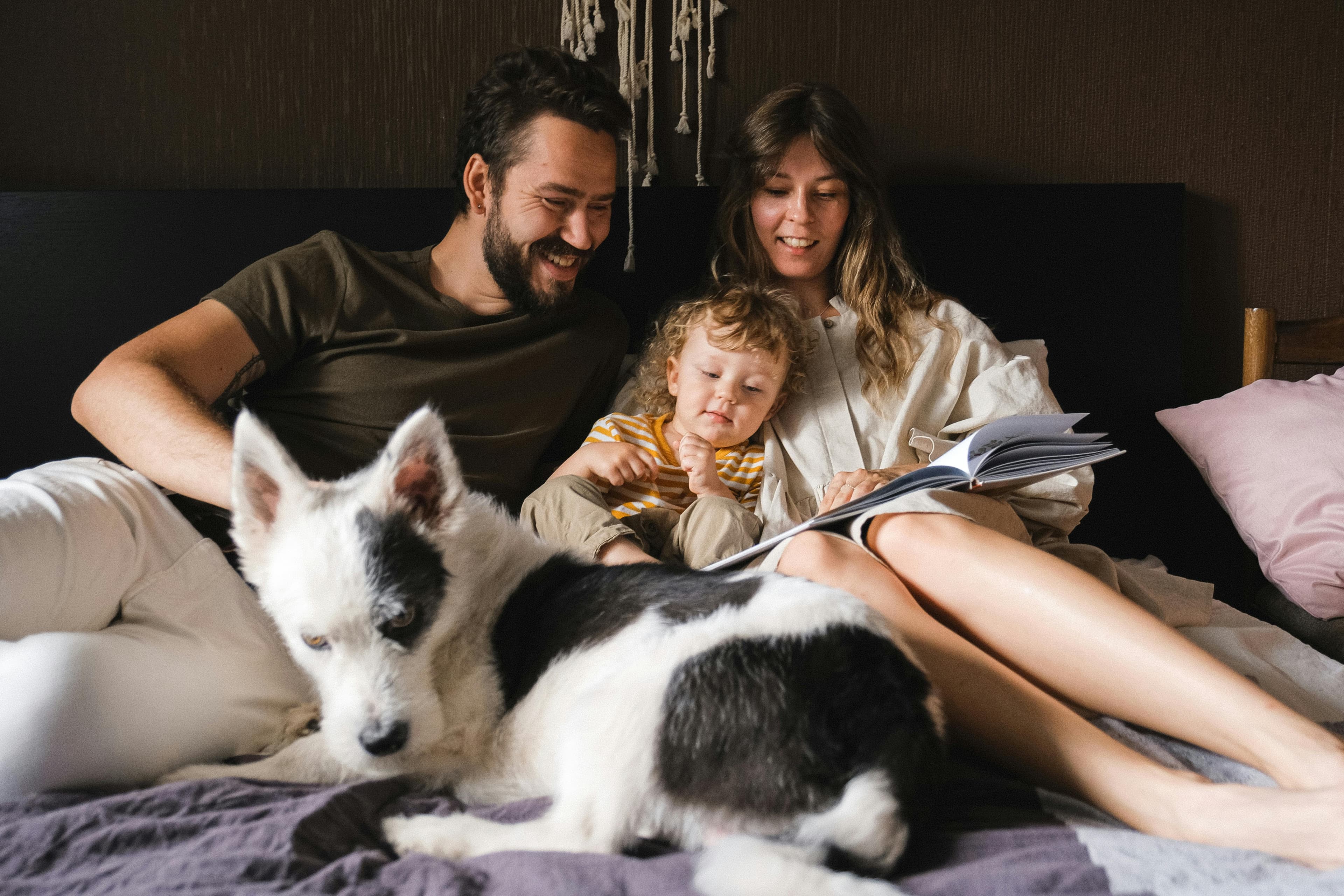 Happy family in front of their new home